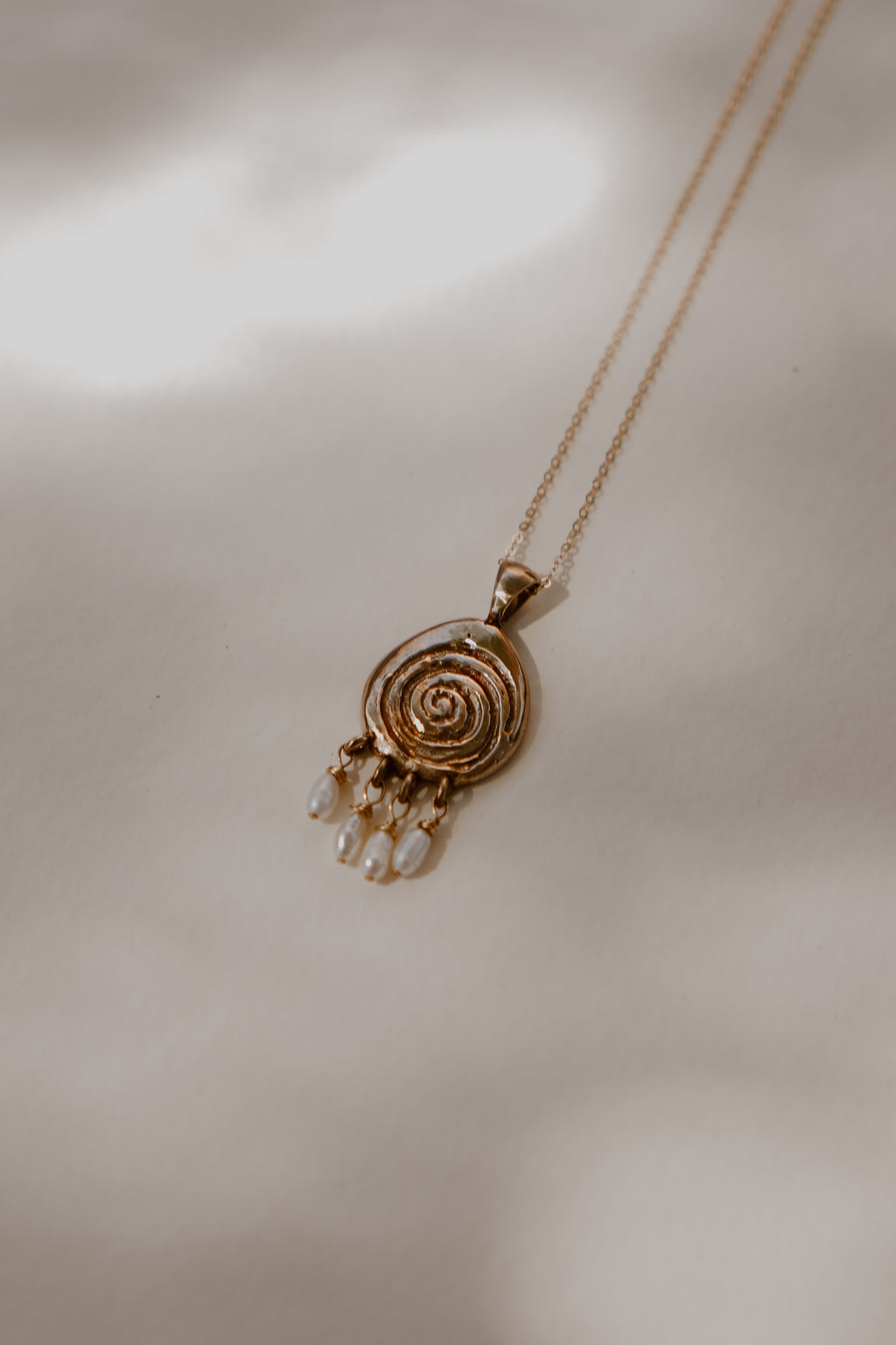 Volute with Pearl
