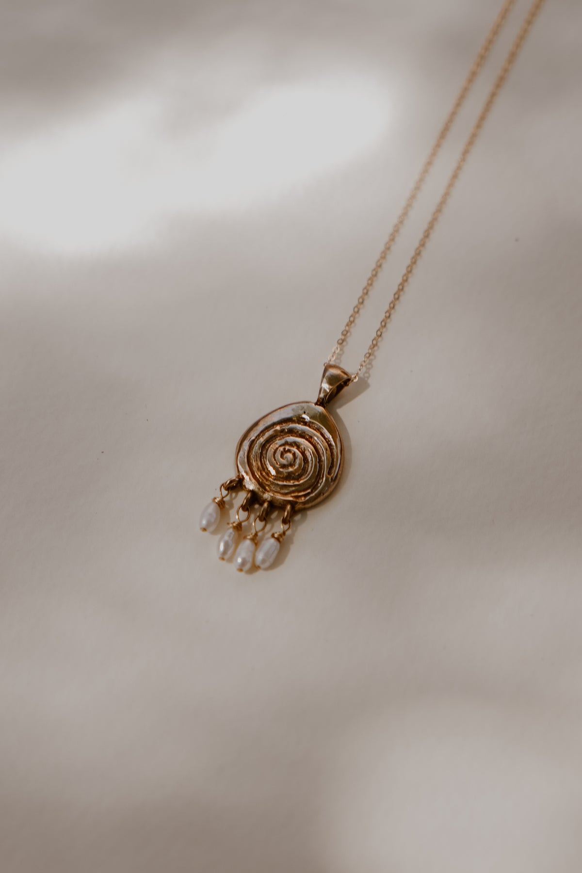 Volute with Pearl