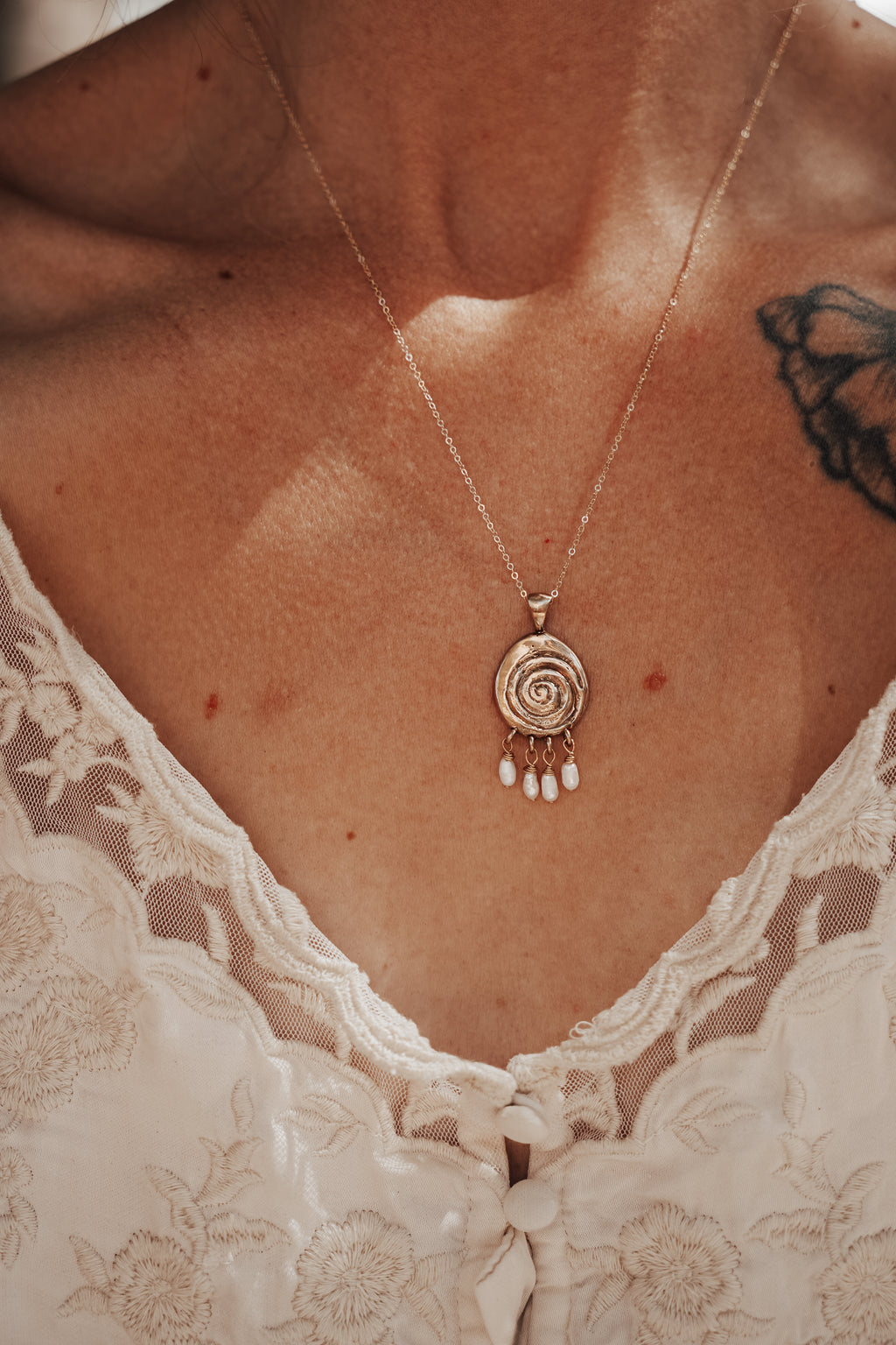 Volute with Pearl