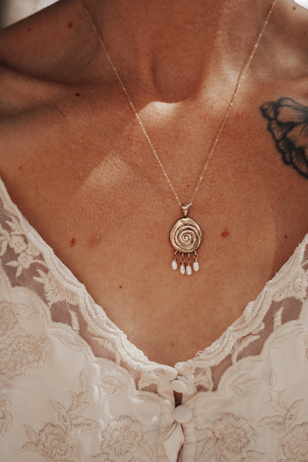 Volute with Pearl